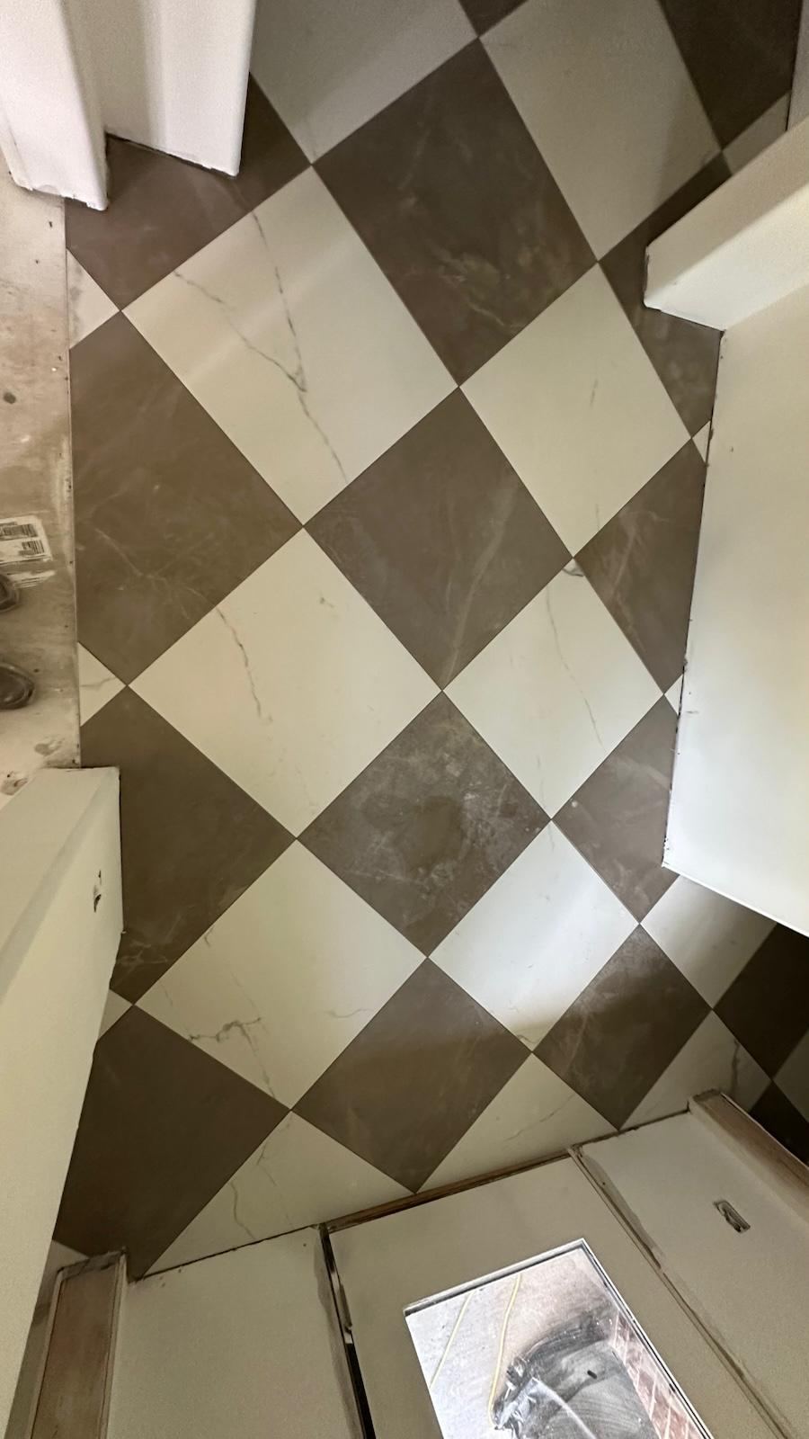Brown and cream diagonal checkerboard tile floor